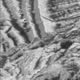 Close-up view of Europa’s surface, as captured by NASA’s now-ended Galileo mission. The area in the center shows the effects of impact gardening.